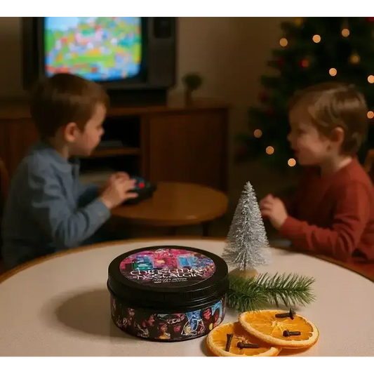 Christmas Nostalgia candle on a table with dried orange slices, two children by a TV behind