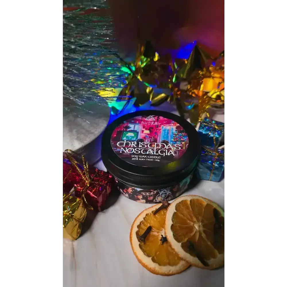 Christmas Nostalgia candle tin with dried orange slices and small wrapped gifts