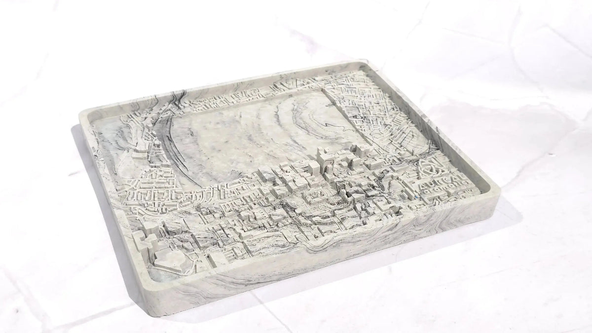 Empty grey marbled Harland and Wolff candle base with a raised street map and the Aureal logo