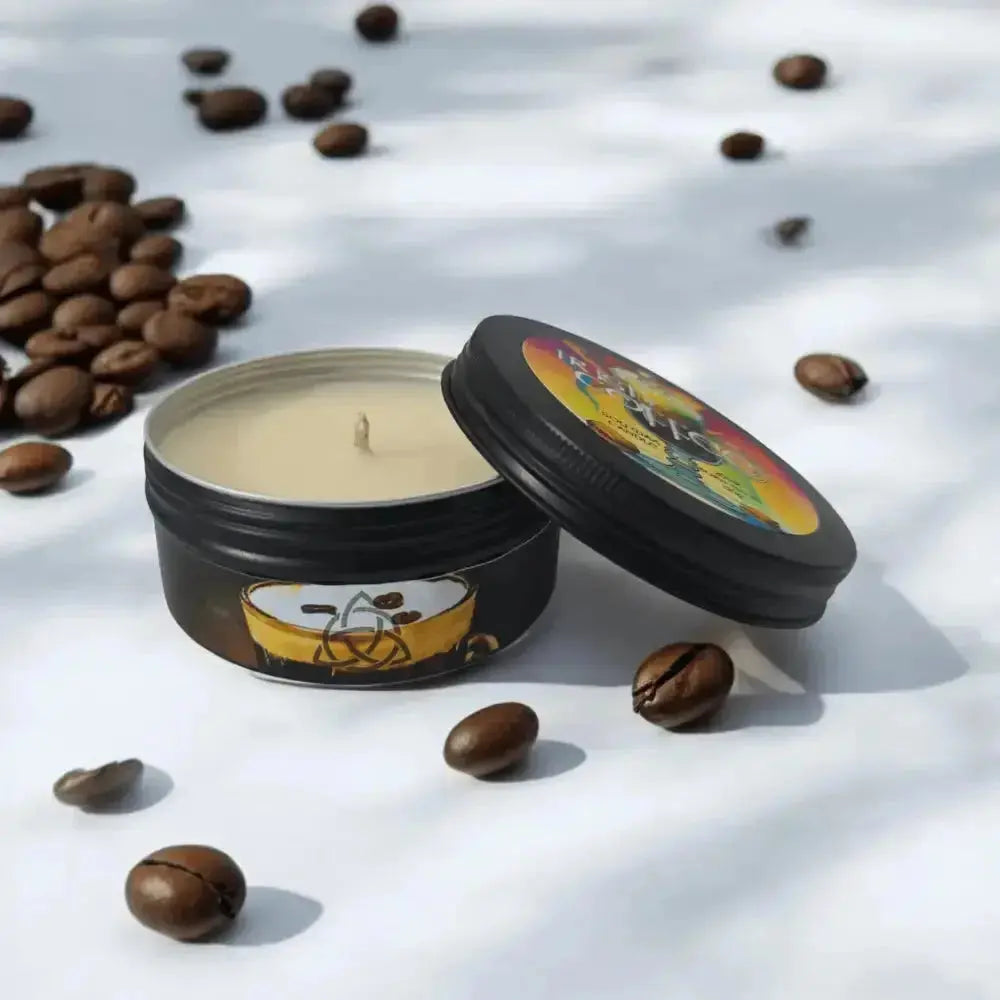 Black tin candle with a coffee cup label among coffee beans, lid open beside it
