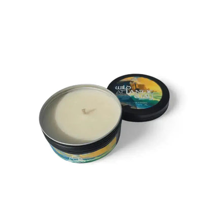 Wild Atlantic Way candle in a black tin with its lid beside it