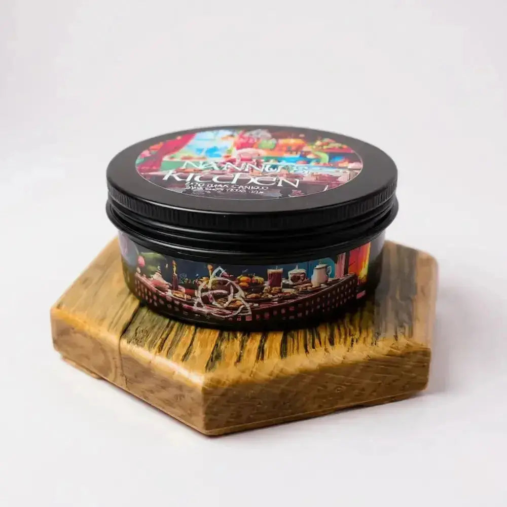 Nanny's Kitchen candle tin on a hexagon wooden stand