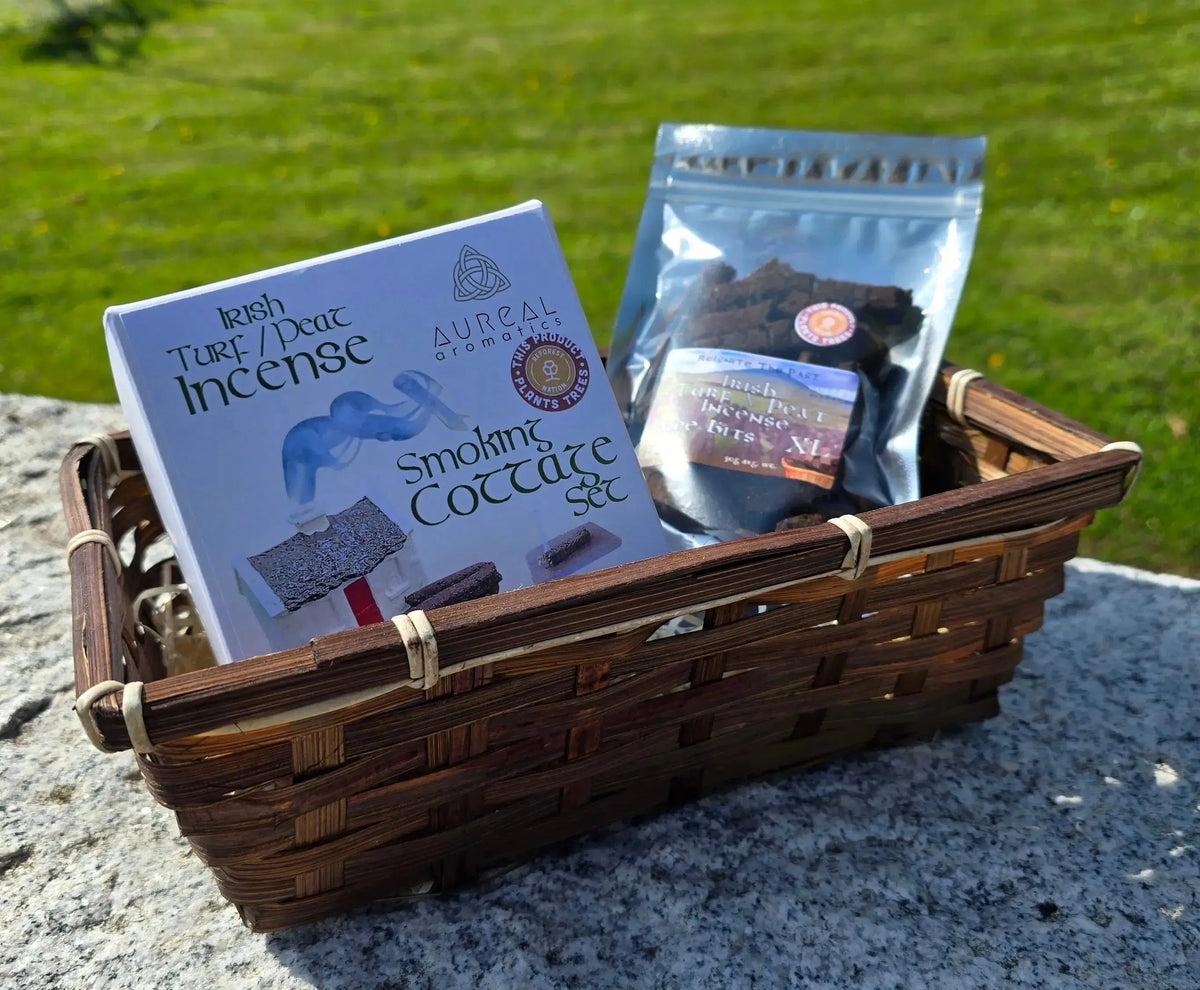 Wicker basket holding a Smoking Cottage Set box and a Wee Bits foil bag, outdoors