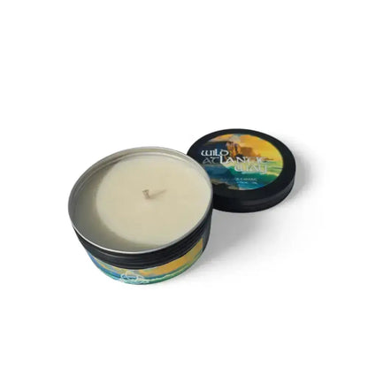 Wild Atlantic Way candle in a black tin with its lid beside it