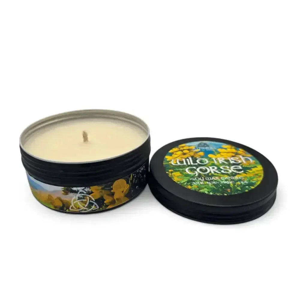 Wild Irish Gorse soy wax candle in a black tin with its lid beside it